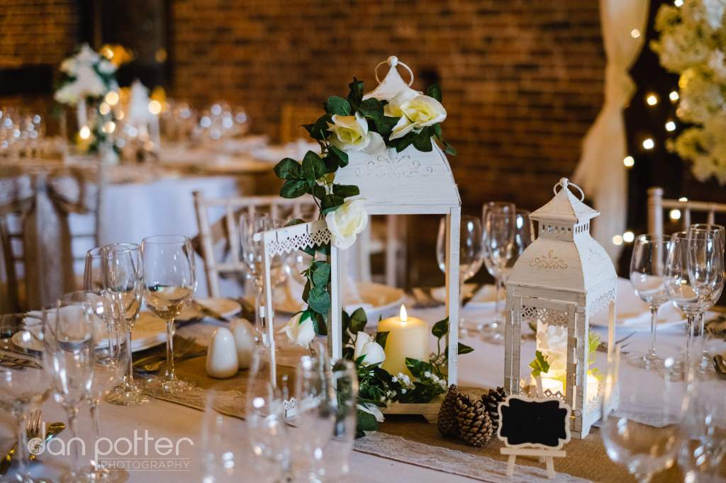 wedding-reception-dinner-table-decoration-centrepieces-allington-castle-barn-1